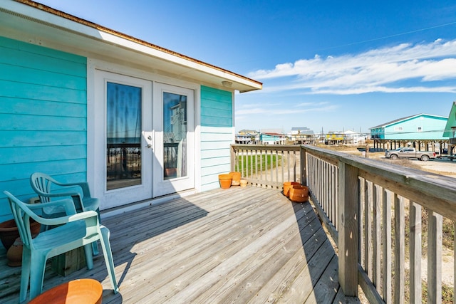 wooden terrace featuring french doors