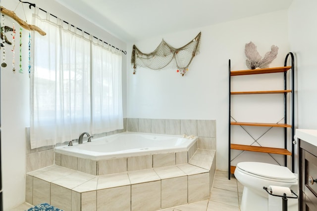 full bath with a garden tub, vanity, toilet, and tile patterned floors