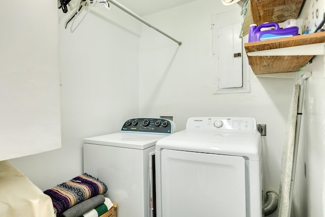 washroom with laundry area, electric panel, and separate washer and dryer