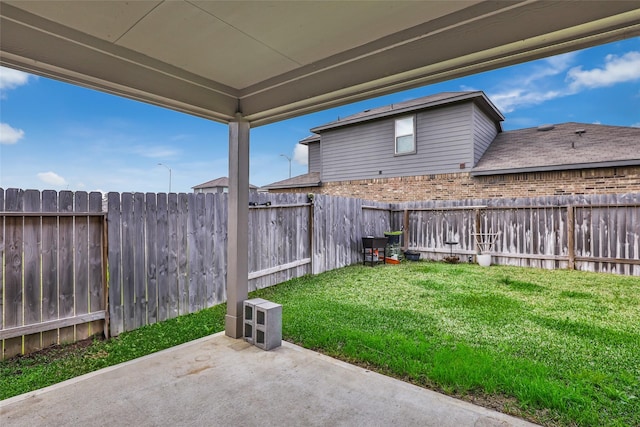 view of yard featuring a fenced backyard and a patio