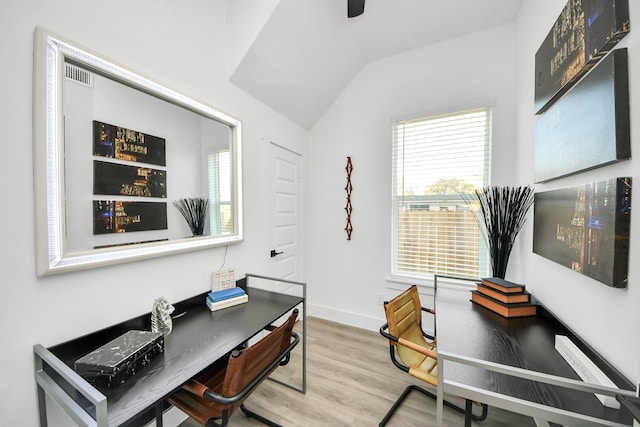 office with lofted ceiling, baseboards, and wood finished floors