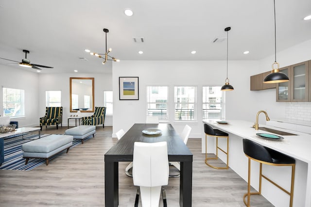 dining area featuring recessed lighting, visible vents, ceiling fan, and light wood-style flooring