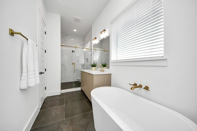 bathroom featuring visible vents, vanity, a freestanding bath, a marble finish shower, and tile patterned floors