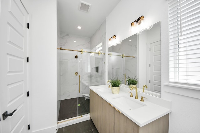 bathroom with recessed lighting, a marble finish shower, visible vents, and vanity