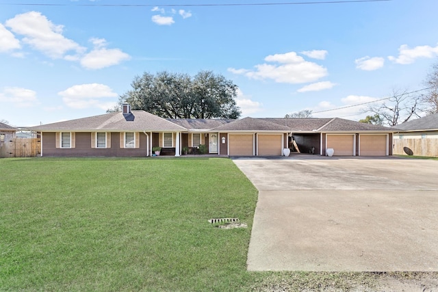 single story home with a garage, concrete driveway, a chimney, fence, and a front lawn