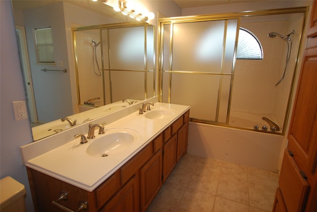 full bath featuring double vanity, shower / bath combination with glass door, and a sink