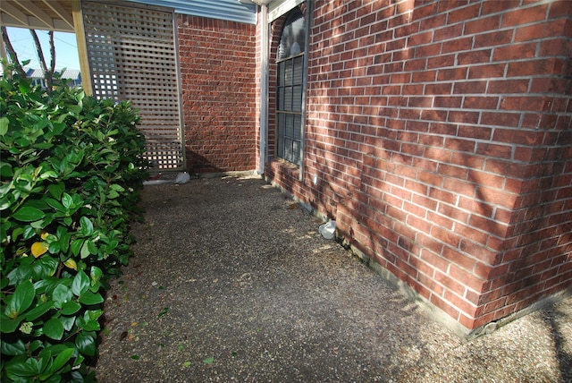 exterior space featuring brick siding