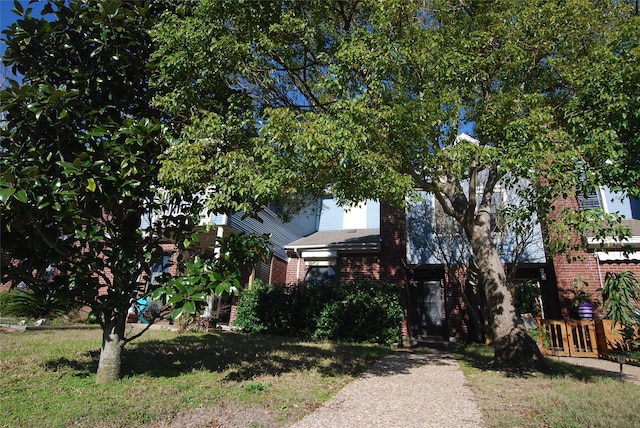 view of front of home with brick siding