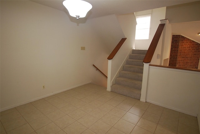 stairs with tile patterned flooring and baseboards