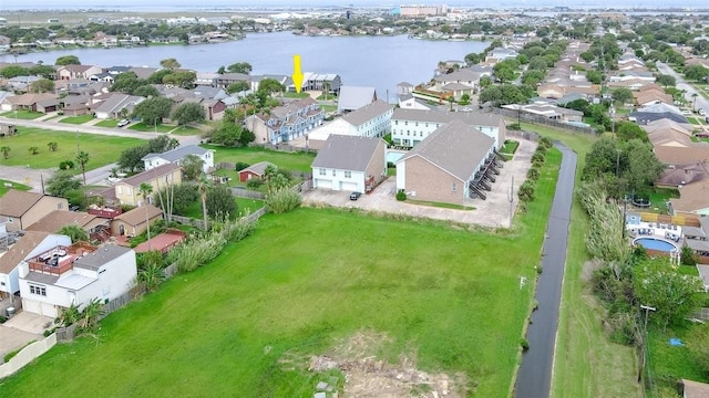 birds eye view of property featuring a water view and a residential view