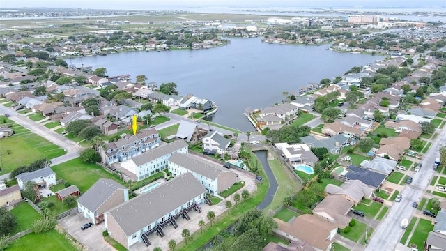 bird's eye view featuring a water view and a residential view