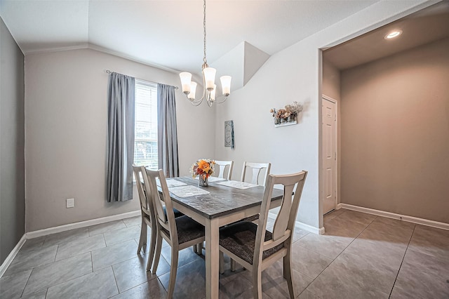 dining area with light tile patterned floors, vaulted ceiling, a chandelier, and baseboards