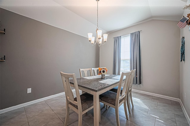 dining room featuring lofted ceiling, baseboards, tile patterned flooring, and a notable chandelier