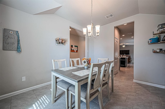 tiled dining area featuring lofted ceiling, visible vents, baseboards, and ceiling fan with notable chandelier