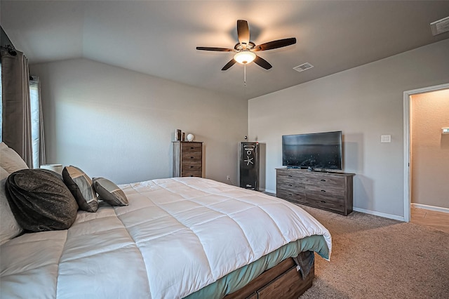 bedroom featuring ceiling fan, lofted ceiling, light carpet, visible vents, and baseboards