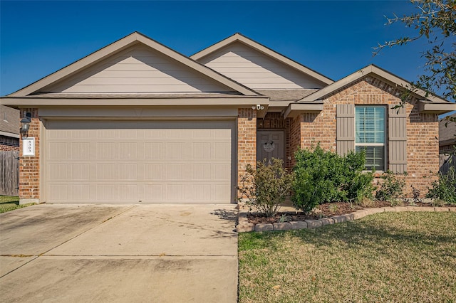 single story home featuring driveway, brick siding, a front lawn, and an attached garage