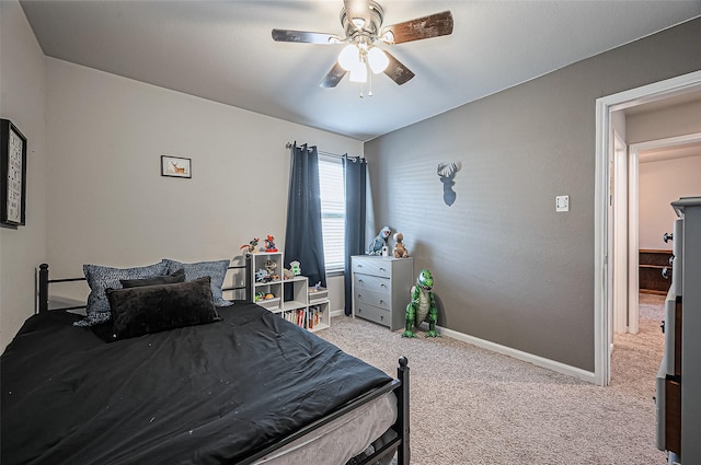 bedroom with carpet floors, ceiling fan, and baseboards