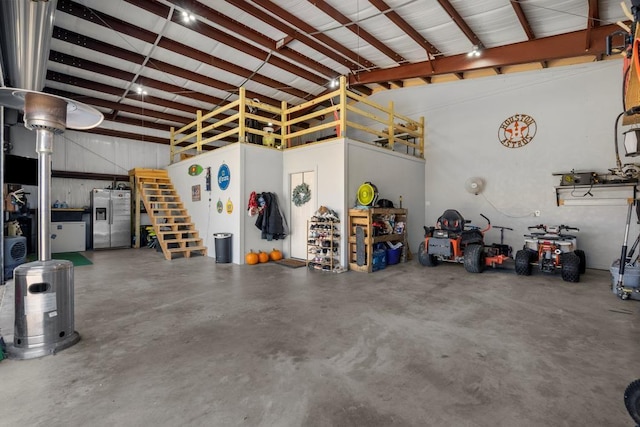 garage with stainless steel fridge