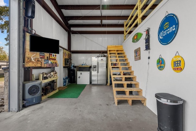 garage with stainless steel fridge