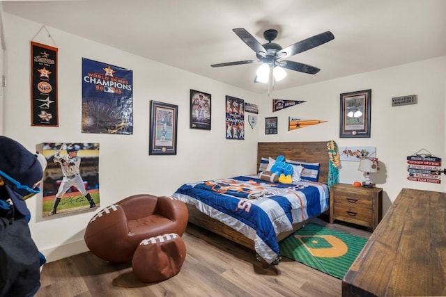 bedroom featuring ceiling fan and wood finished floors