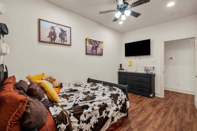 bedroom featuring ceiling fan, baseboards, wood finished floors, and recessed lighting