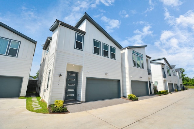 contemporary house featuring a garage and board and batten siding