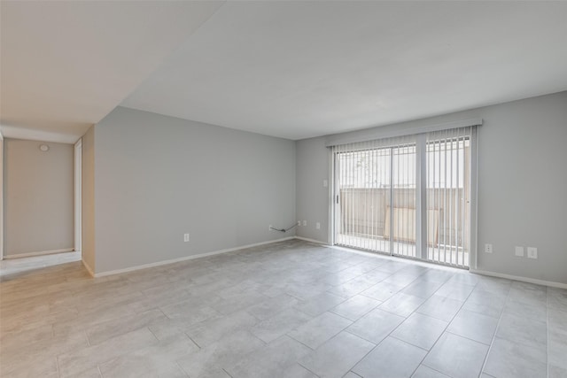 empty room with baseboards