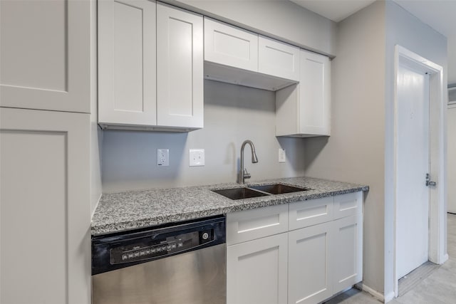 kitchen featuring white cabinets, a sink, and stainless steel dishwasher