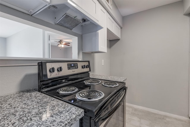 kitchen featuring light stone countertops, stainless steel range with electric stovetop, under cabinet range hood, and white cabinets