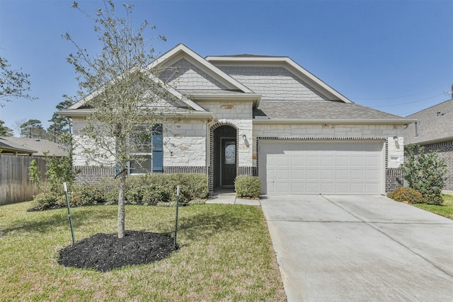 view of front of property with concrete driveway, fence, a garage, stone siding, and a front lawn