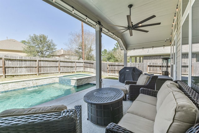 view of patio / terrace with a pool with connected hot tub, outdoor lounge area, area for grilling, ceiling fan, and a fenced backyard