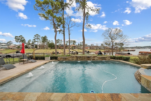 view of pool with a residential view, fence, and a fenced in pool