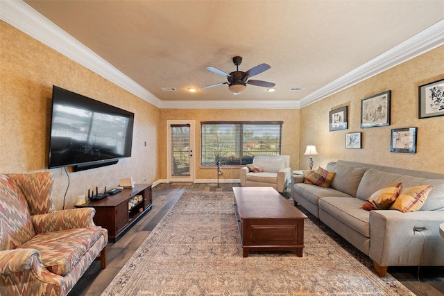 living room with ornamental molding, a ceiling fan, visible vents, and wood finished floors