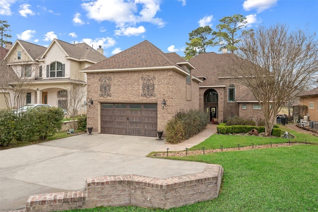 french provincial home with an attached garage, brick siding, a shingled roof, driveway, and a front lawn