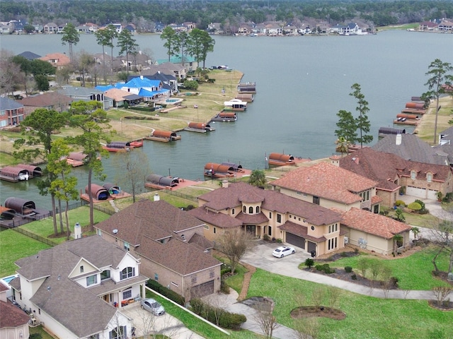 bird's eye view featuring a residential view and a water view