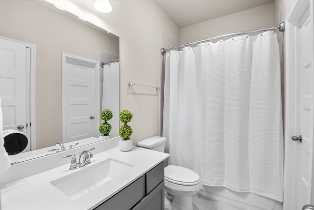 bathroom with toilet, shower / bath combo with shower curtain, and vanity