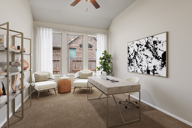 carpeted office space with vaulted ceiling, ceiling fan, and baseboards