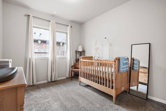 bedroom featuring carpet and baseboards