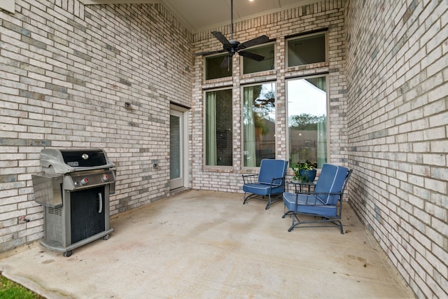 view of patio featuring a grill and a ceiling fan