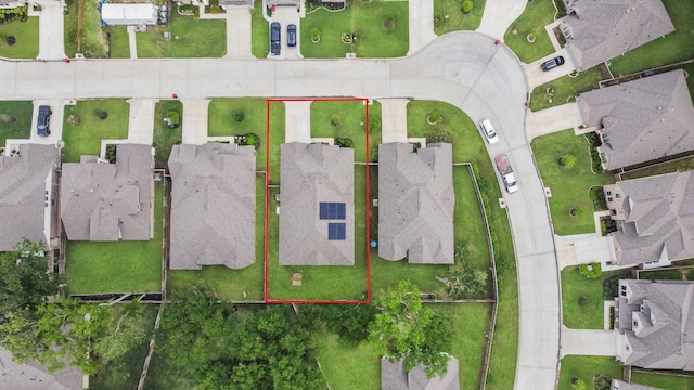 birds eye view of property with a residential view