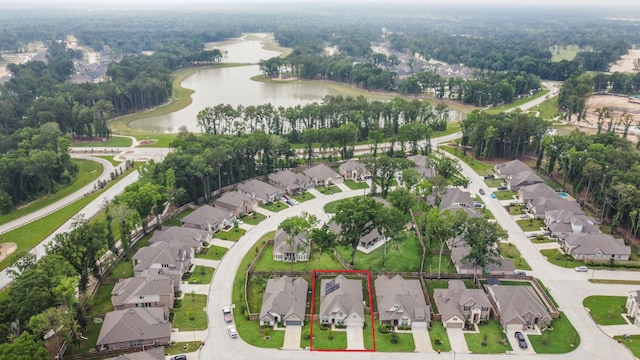 birds eye view of property featuring a water view and a residential view