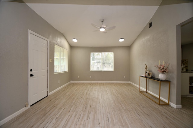 unfurnished room featuring baseboards, a ceiling fan, and wood finished floors