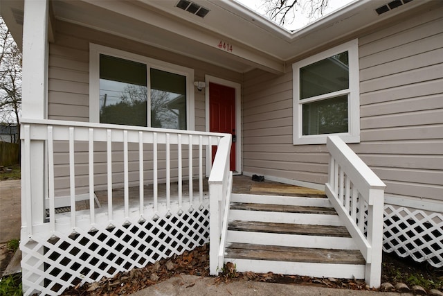 entrance to property featuring visible vents