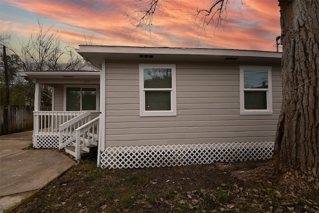 view of property exterior at dusk