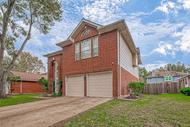 view of front facade with a front yard, fence, concrete driveway, and brick siding