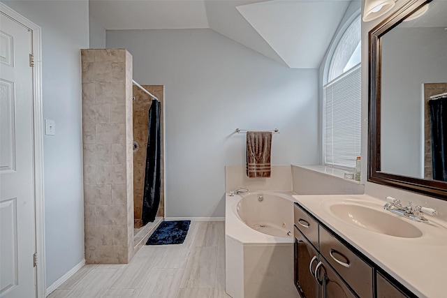 full bathroom featuring tiled shower, vaulted ceiling, vanity, and a tub with jets