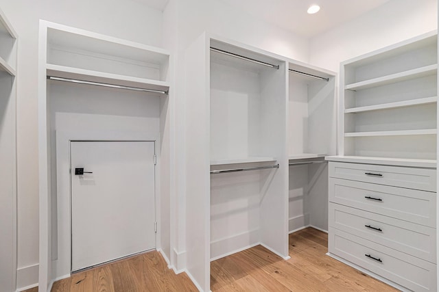 spacious closet with light wood-style flooring