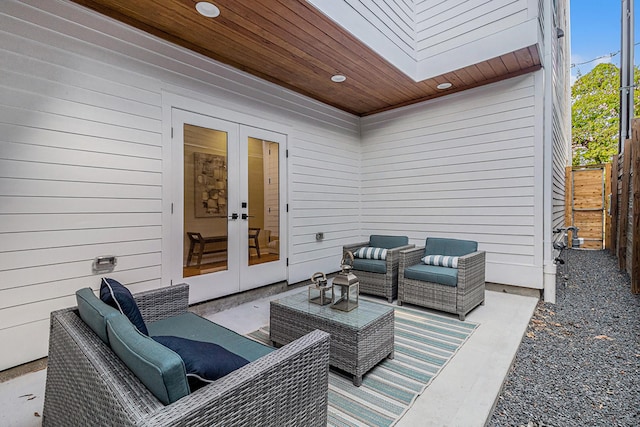 view of patio with fence private yard, an outdoor hangout area, and french doors