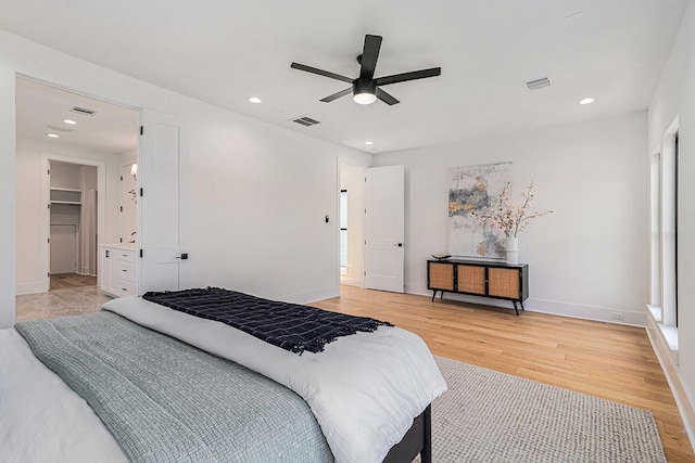 bedroom with light wood-type flooring, visible vents, and recessed lighting