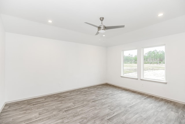 spare room with light wood finished floors, ceiling fan, and recessed lighting